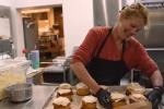 Patti Dailey preparing cinnamon rolls in her bakery.