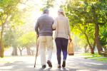 two people walking away from camera