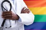 doctor with a backdrop of pride colors 