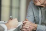 A doctor and patient meet - close up image of hands. 