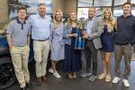 Dr. Randall presenting family with trophy