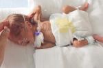Small baby in NICU incubator