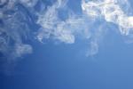 Cigarette/vapor smoke against a blue sky