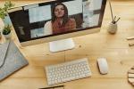 desk with woman on computer