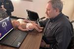 Steven McElroy, chief of neonatology, trains on POCUS.