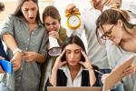 Group of business workers screaming at stressed partner at the office.