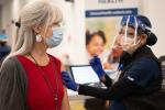 Woman receiving her vaccine