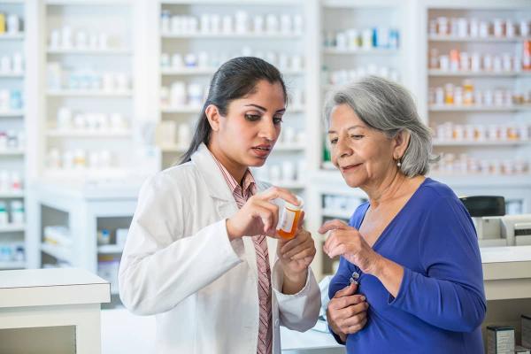 Pharmacist helping patient