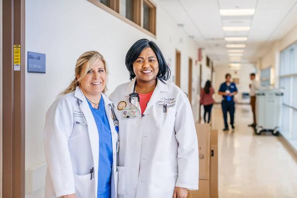 Two female doctors smiling