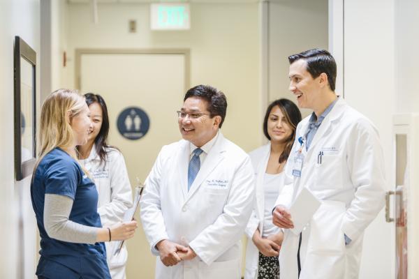 UC Irvine Trainees in hallway talking