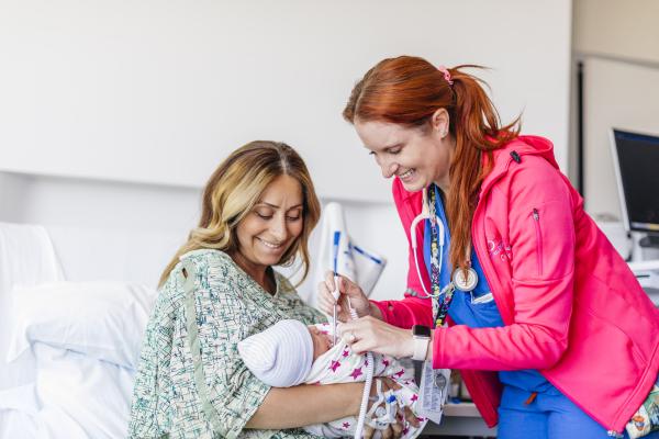 photo of a person holding a baby with a UC provider