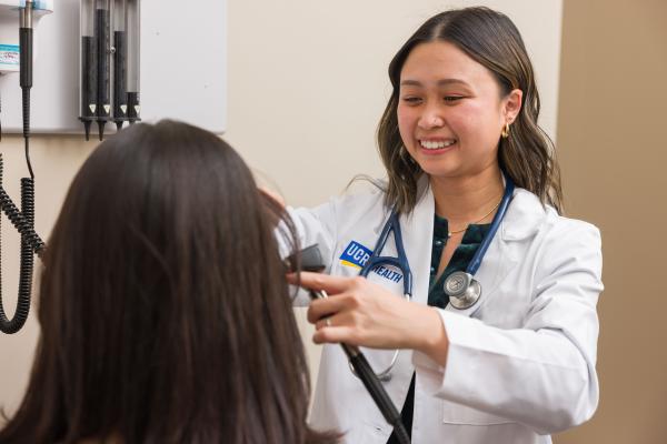UCR Health clinician examining a patient