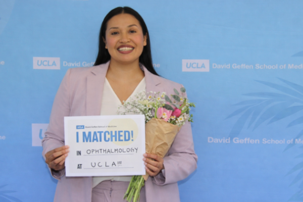 image of Karla Murillo holding a sign that says "I matched" at UCLA