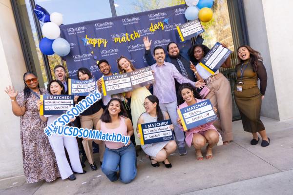 Group of photos of students with match day signs