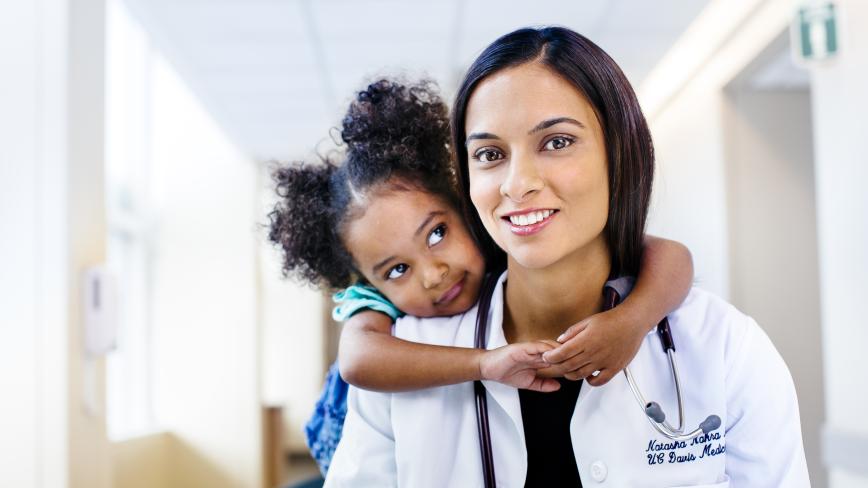 Child hugging a doctor
