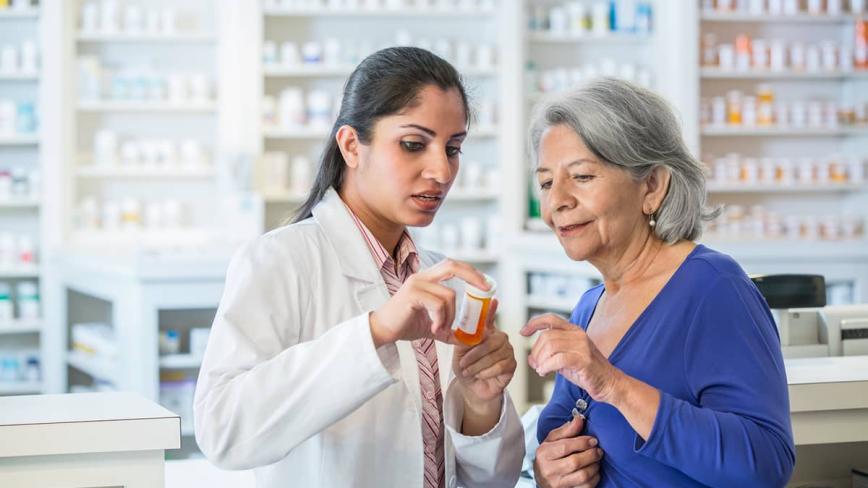Pharmacist helping patient