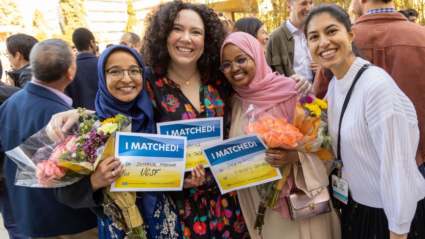 UC medical school students celebrate Match Day 2023. Four students together in a group with three holding signs saying "I Matched!"