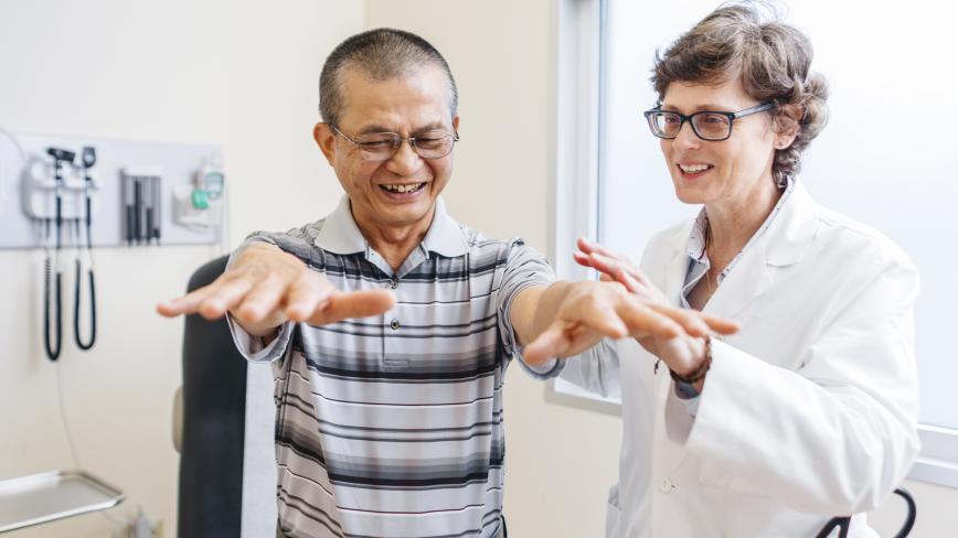 a physician caring for an elderly man 