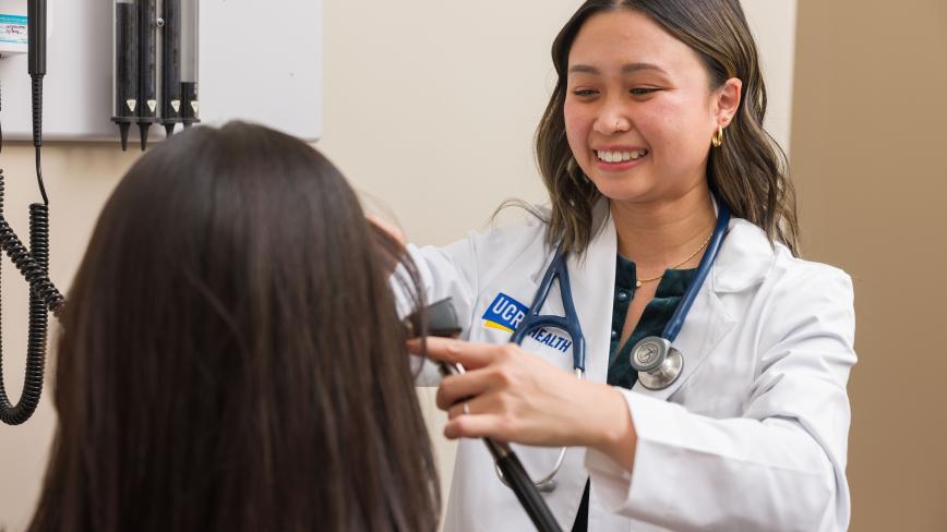 UCR Health clinician examining a patient