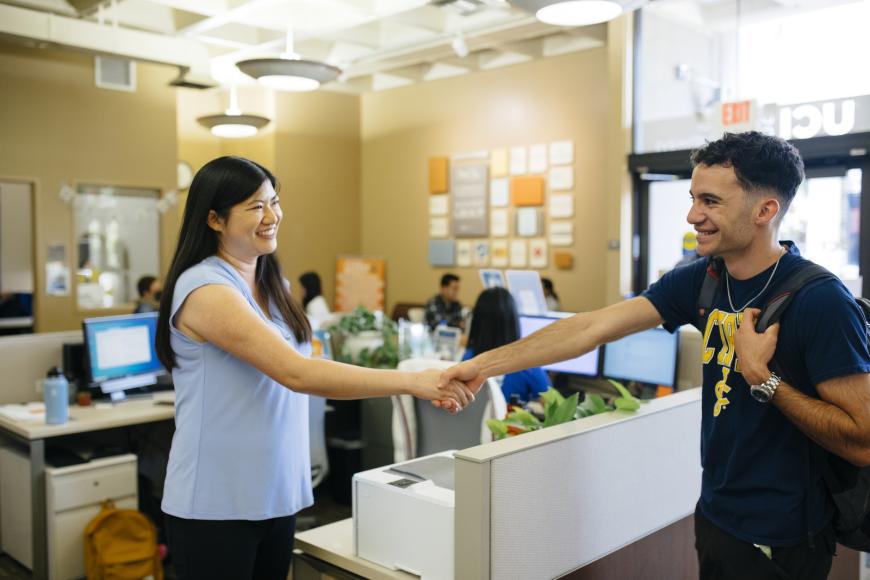People meeting in an office and shaking hands